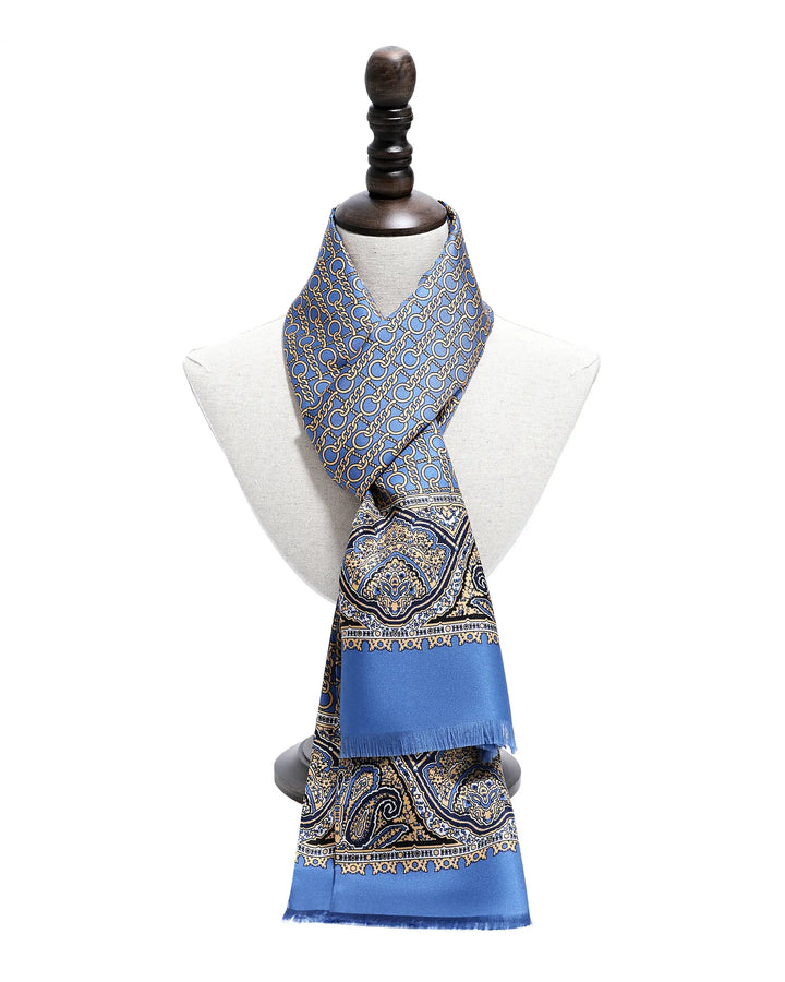 Blue patterned scarf on a mannequin against a white background.#color_azure-blue
