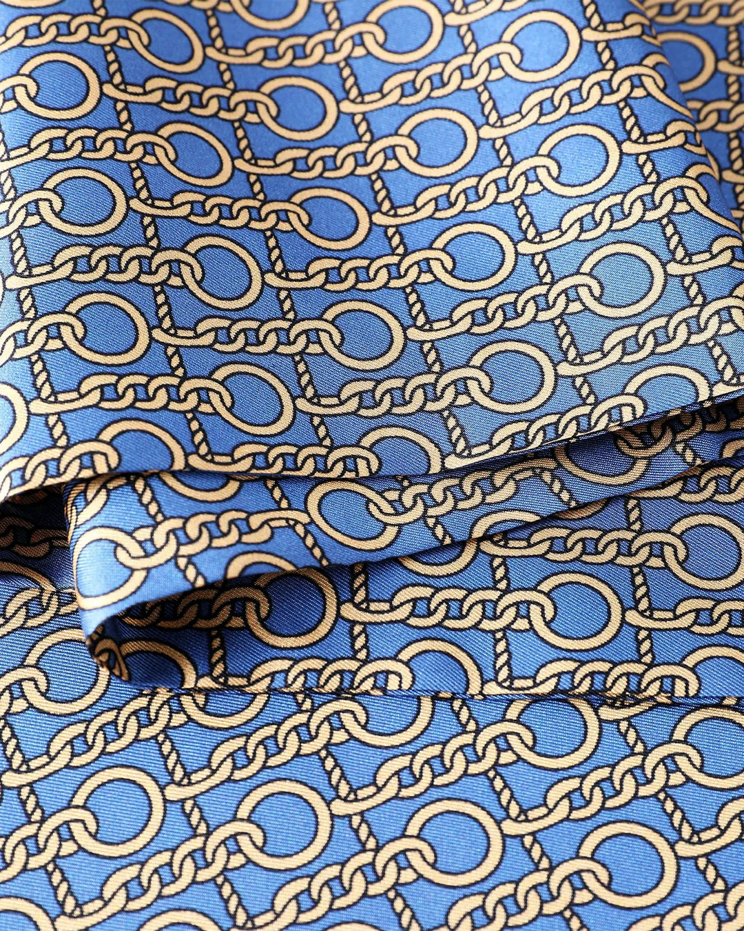Blue fabric with gold chain pattern.#color_azure-blue