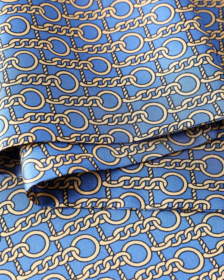 Blue fabric with gold chain pattern.#color_azure-blue
