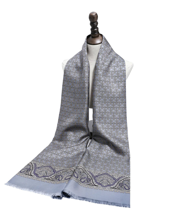 Double-sided grey blue silk scarf showing luxurious texture and elegant tassel finish.#color_dove-gray