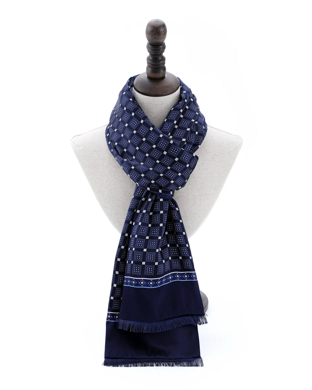 Classic wrap style featuring navy blue double-sided brushed silk scarf with geometric design.#color_navy-blue