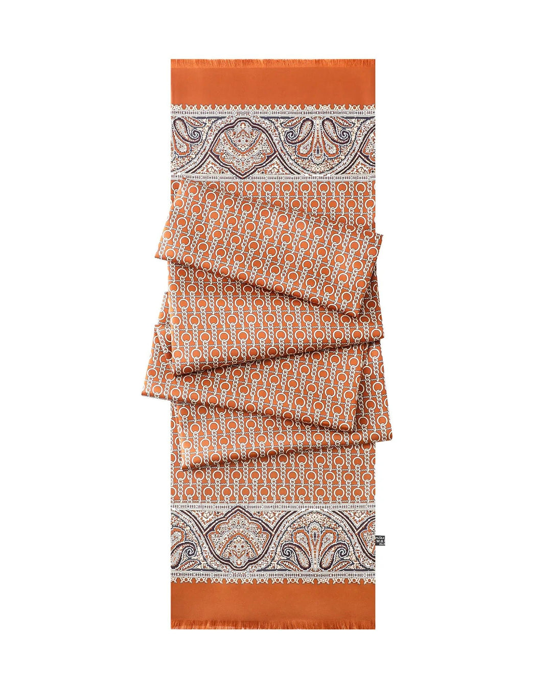 Close-up view of orange paisley pattern on luxury silk twill scarf for men.#color_cinnamon