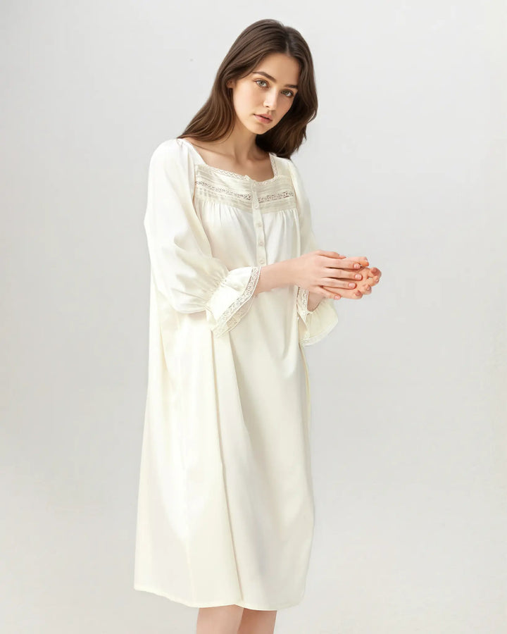 Close-up of square neckline with lace trim on ivory white silk nightgown.#color_creamy-white