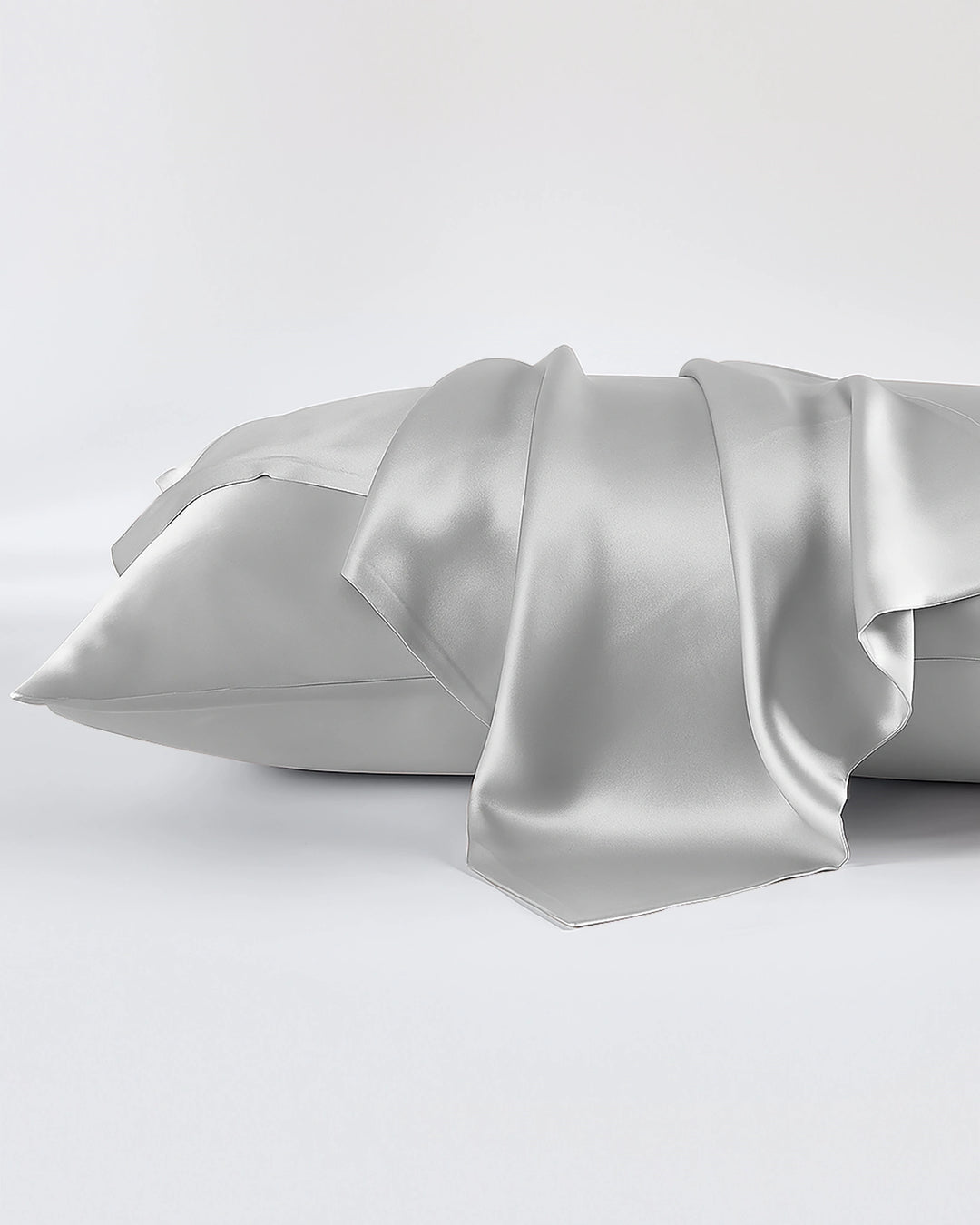 Silver satin pillowcase on a white background