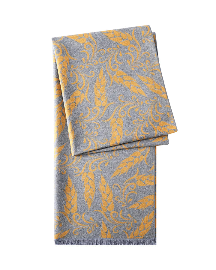 Folded fabric with yellow pattern on a white background
