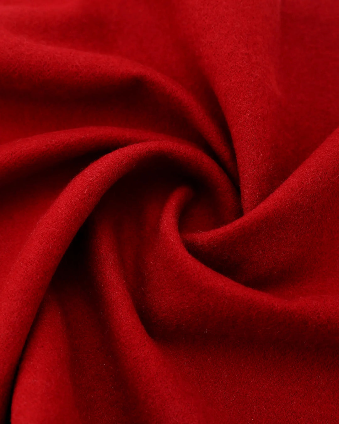 A close-up of bright red fabric arranged in a spiral drape, showing the material texture and color.#color_wine-red