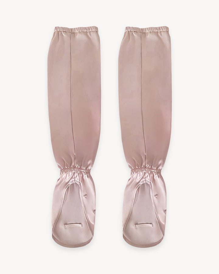 A pair of light pink Sun Protection Silk Over Sleeves from SusanSilk with elasticized openings and thumb holes.