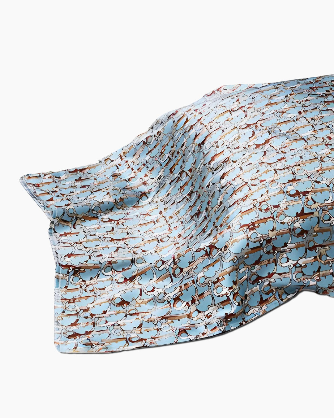 A 19 Momme Printing Silk Pillow Cover by SusanSilk, featuring a light blue hue with an intricate pattern of brown and beige intertwining shapes, draped gracefully against a white background.