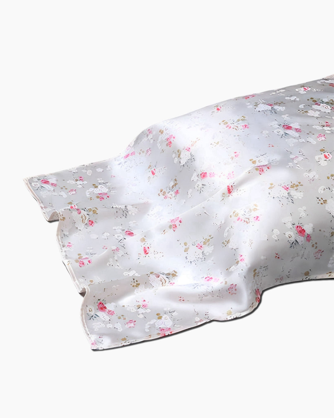 A light grey 19 Momme Printing Silk Pillow Cover by SusanSilk, adorned with a floral pattern showcasing pink and white flowers, lies spread out.