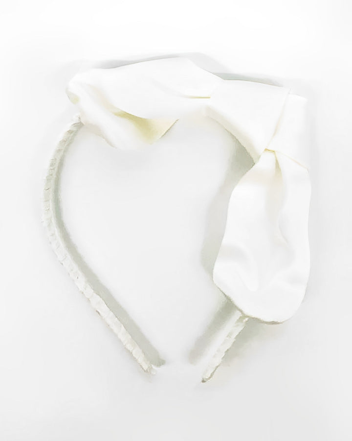The Pure Color Bow Knot Silk Headband from SusanSilk, featuring a large silk bow and a white color, is displayed against a plain white background.
