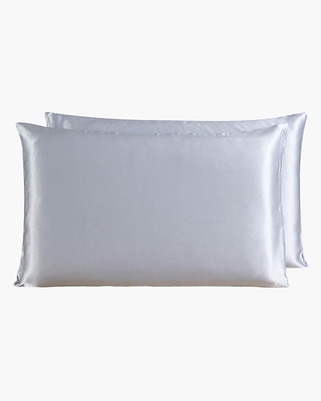 Two SusanSilk 22 Momme Beauty Silk Pillowcase Zippers, crafted from the finest silk, are stacked, one slightly behind the other, against a plain white background.