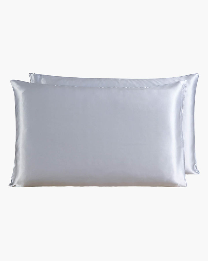 Two SusanSilk 22 Momme Beauty Silk Pillowcase Zippers, crafted from the finest silk, are stacked, one slightly behind the other, against a plain white background.