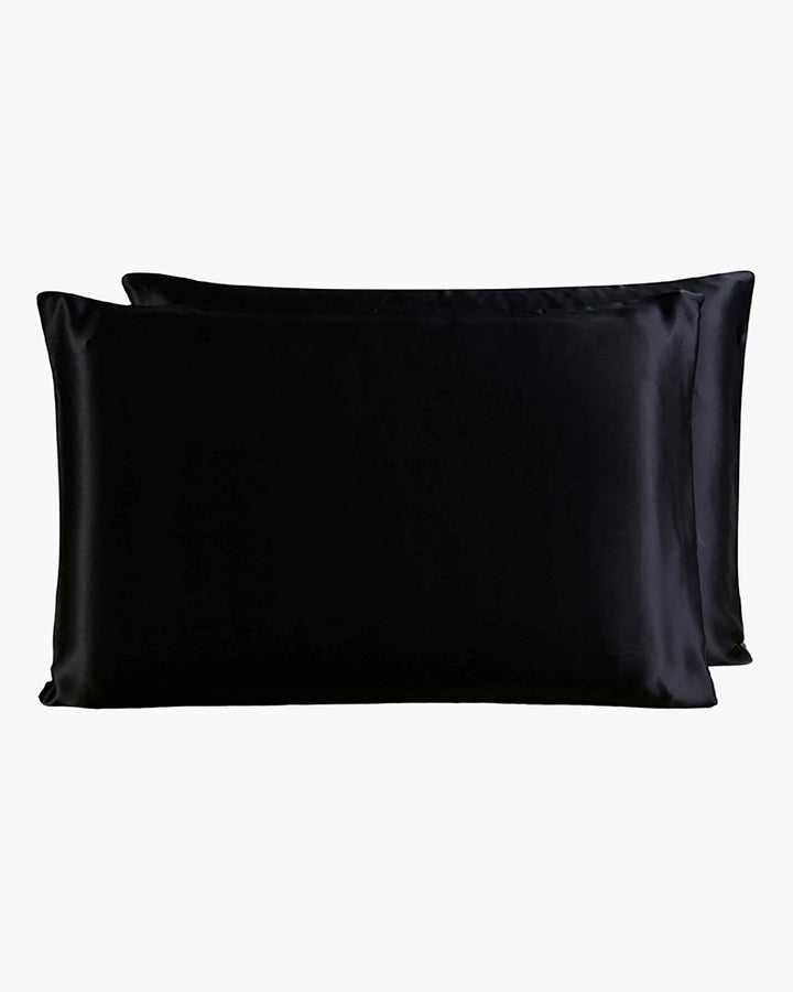 Two SusanSilk 22 Momme Beauty Silk Pillowcase Zippers, in a sleek black satin finish reminiscent of luxurious silk, are placed one behind the other against a white background.