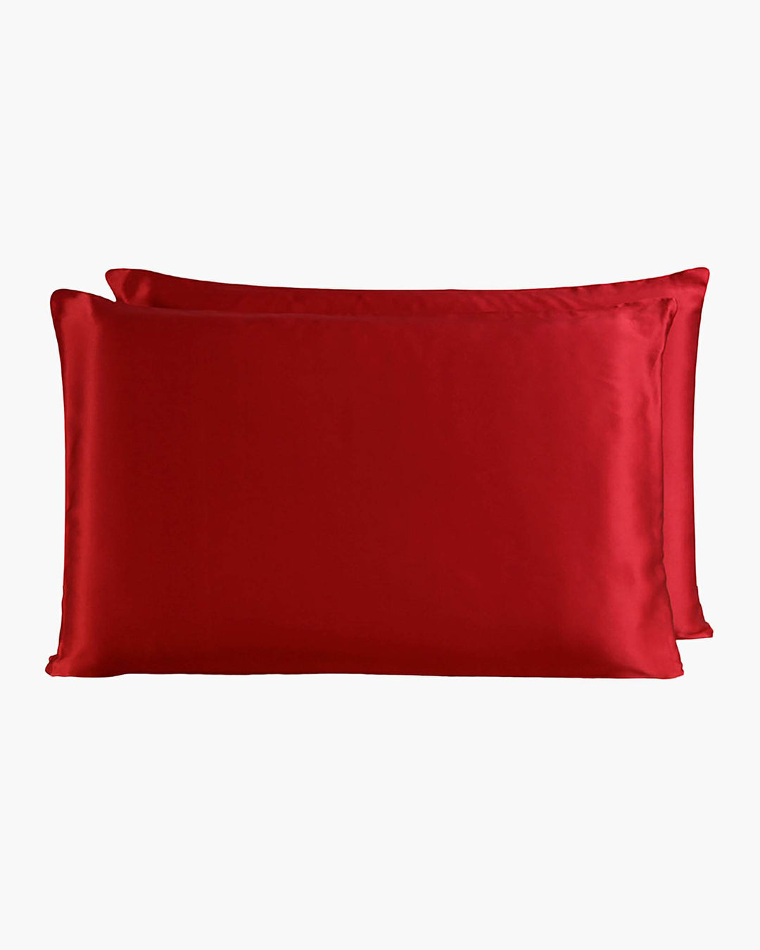 Two luxurious SusanSilk 22 Momme Beauty Silk Pillowcase Zippers in a vibrant red hue, stacked on top of each other against a plain white background.