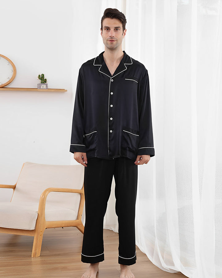 Model wearing a black 25 momme mulberry silk pajama set for men with smooth finish, lapel collar, and premium comfort.