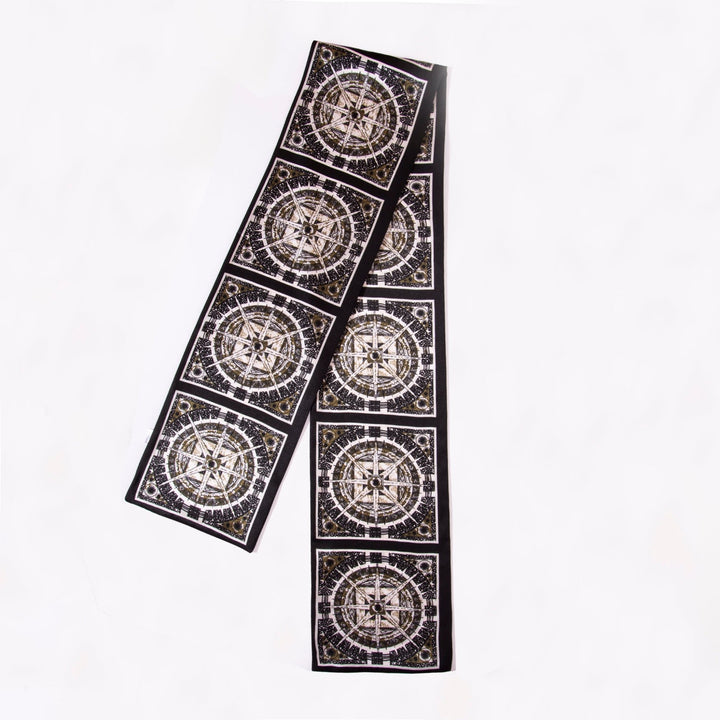 Black and white Black Compass Narrow Long Silk Scarf by SusanSilk, featuring a repeating compass rose pattern on a white background.