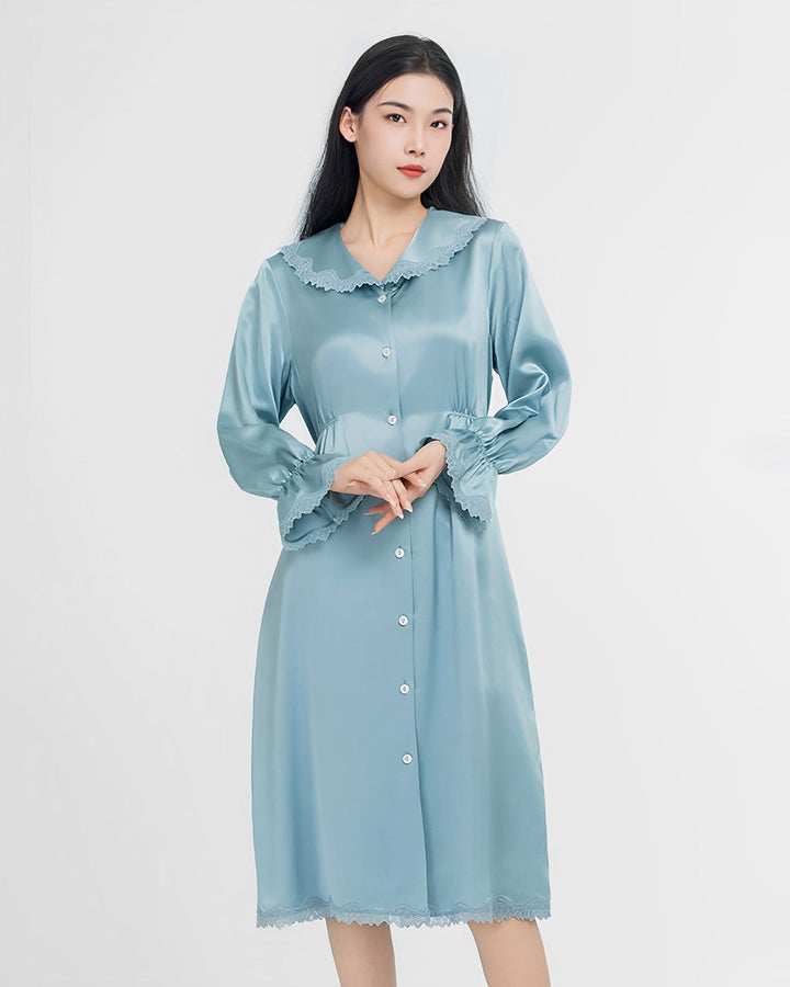 A person wearing a SusanSilk Premium Lace Silk Nightdress in light blue stands against a plain white background.
