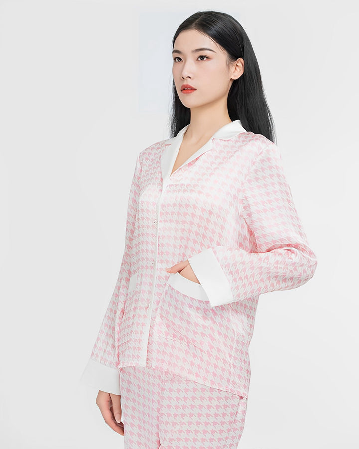 A woman with long black hair is wearing a SusanSilk Houndstooth Silk Pajamas Set. She stands against a plain white background.