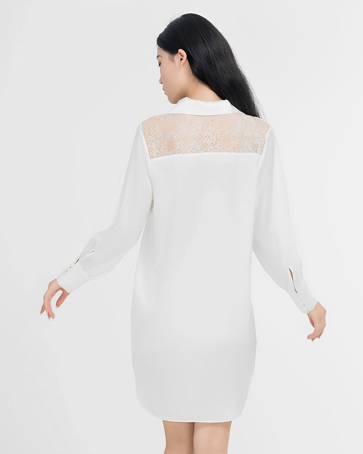 A woman with long black hair is wearing the SusanSilk Premium Lace Silk Shirtdress, featuring a white, long-sleeved design made of silk and a lace panel on the upper back. She is standing against a plain white background, facing away from the camera.