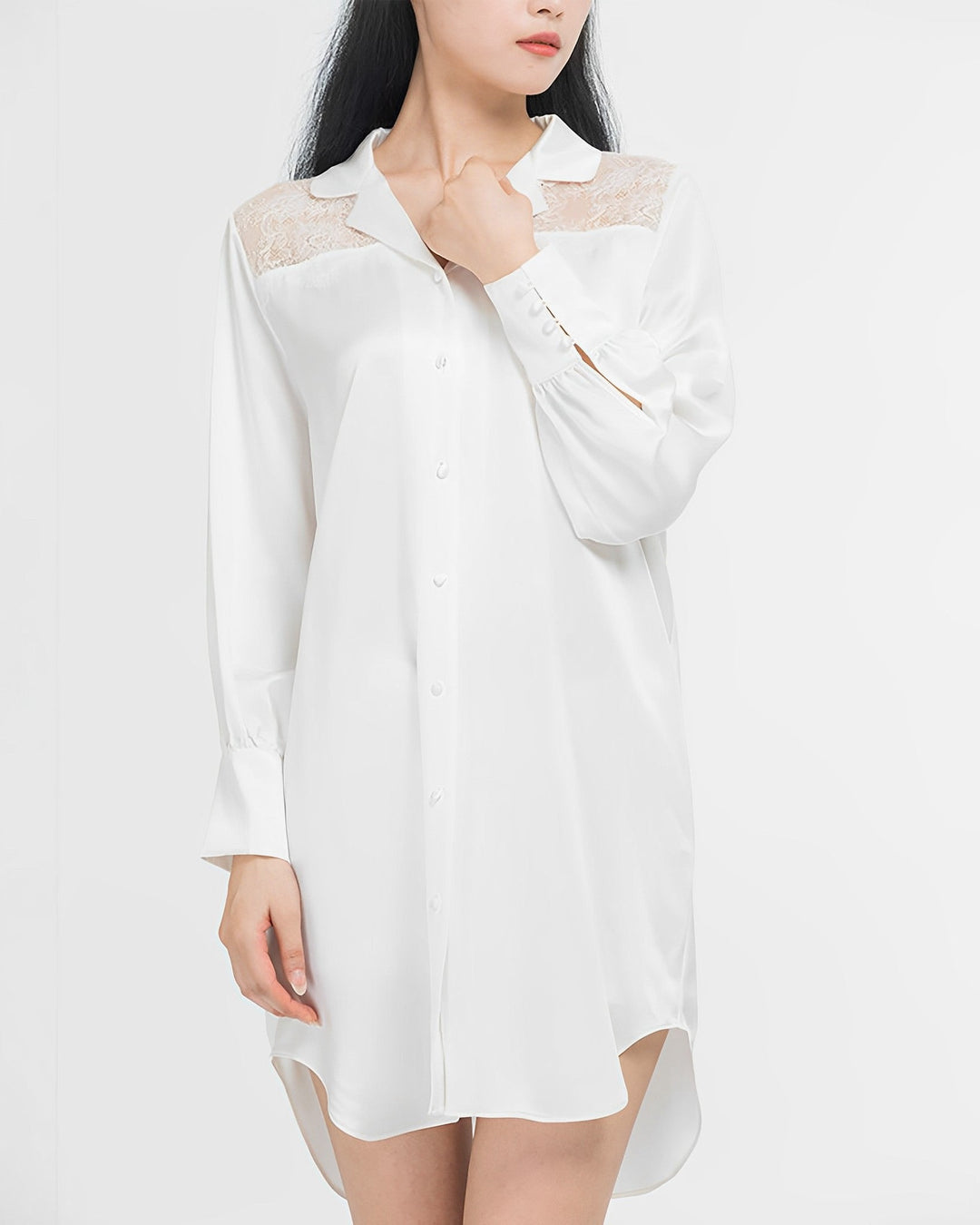 Person wearing a white, long-sleeved Premium Lace Silk Shirtdress from SusanSilk with lace detailing on the shoulders.