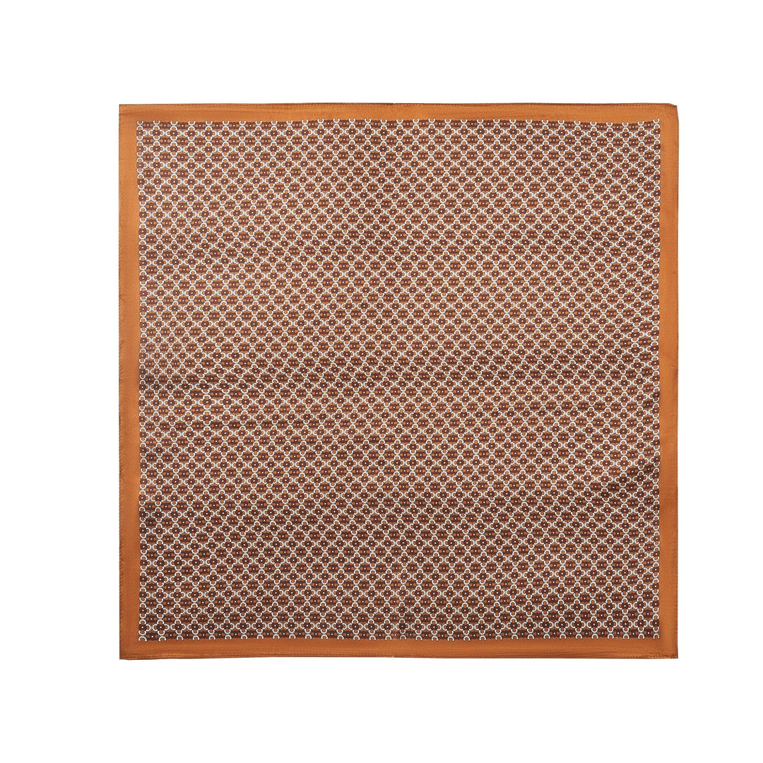 The Lucky Clover Square Silk Scarf from SusanSilk's finest collection is a square silk fabric in brown and white, featuring a patterned grid of small geometric shapes and a solid brown border.