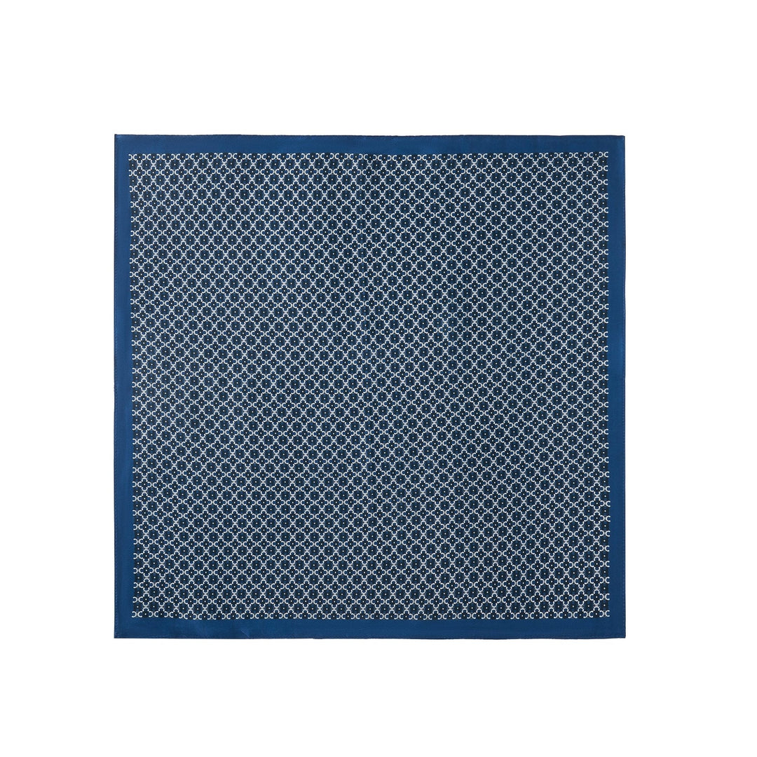 The luxurious Lucky Clover Square Silk Scarf by SusanSilk, crafted from sumptuous silk, features a repeating circular white pattern against a blue background and a solid blue border.