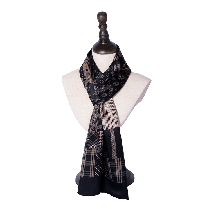 A SusanSilk mannequin elegantly displays the Mix Pattern Long Silk Scarf, draped gracefully around the neck and adorned with intricate geometric patterns.