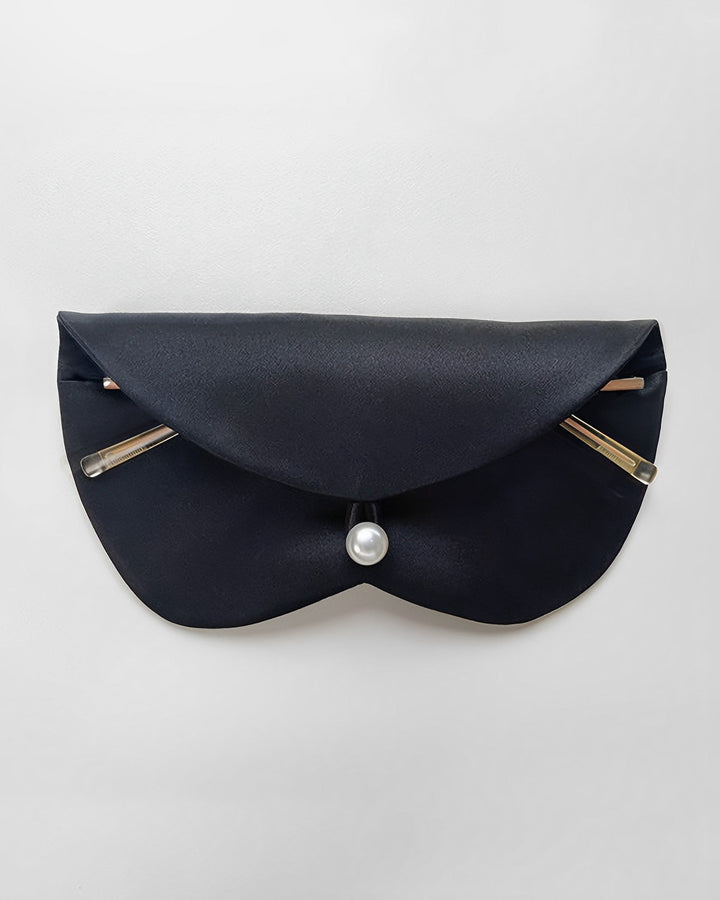 A sleek black glasses pouch with gold accents and a pearl clasp, crafted from luxurious SusanSilk fabric, displayed on a plain white background.