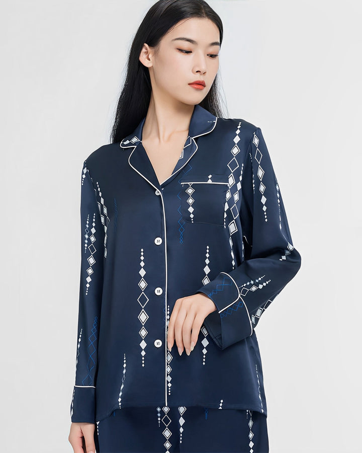 Person wearing a navy blue Diamond Striped Silk Pajamas Set by SusanSilk, standing against a plain background.