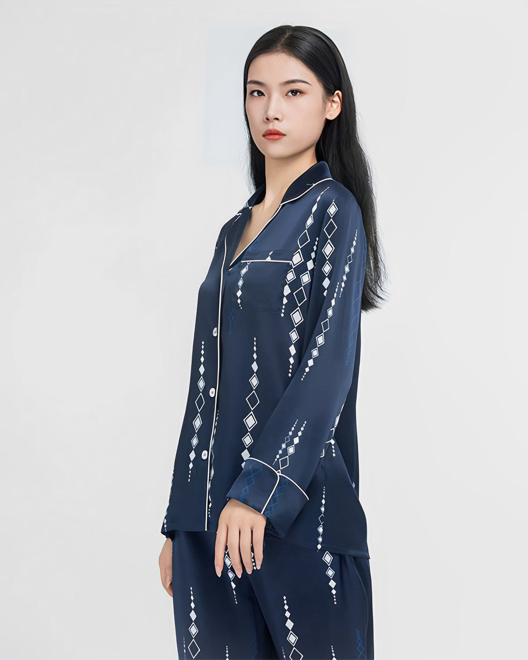 A person wearing the Diamond Striped Silk Pajamas Set from SusanSilk stands against a plain background.